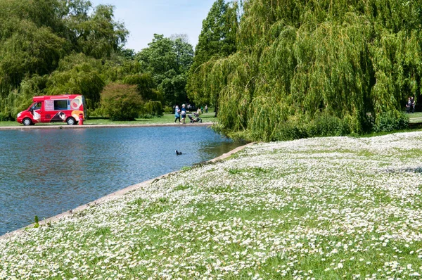 Ice cream van in the park on a sunny summer day