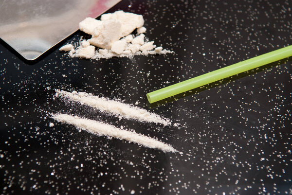 Drug abuse, cocaine chopped and in lines to be taken