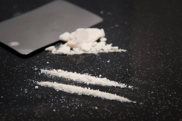 Drug abuse, cocaine chopped and in lines to be taken