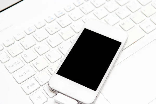 stock image mobile smart phone with a blank screen on a business white backg