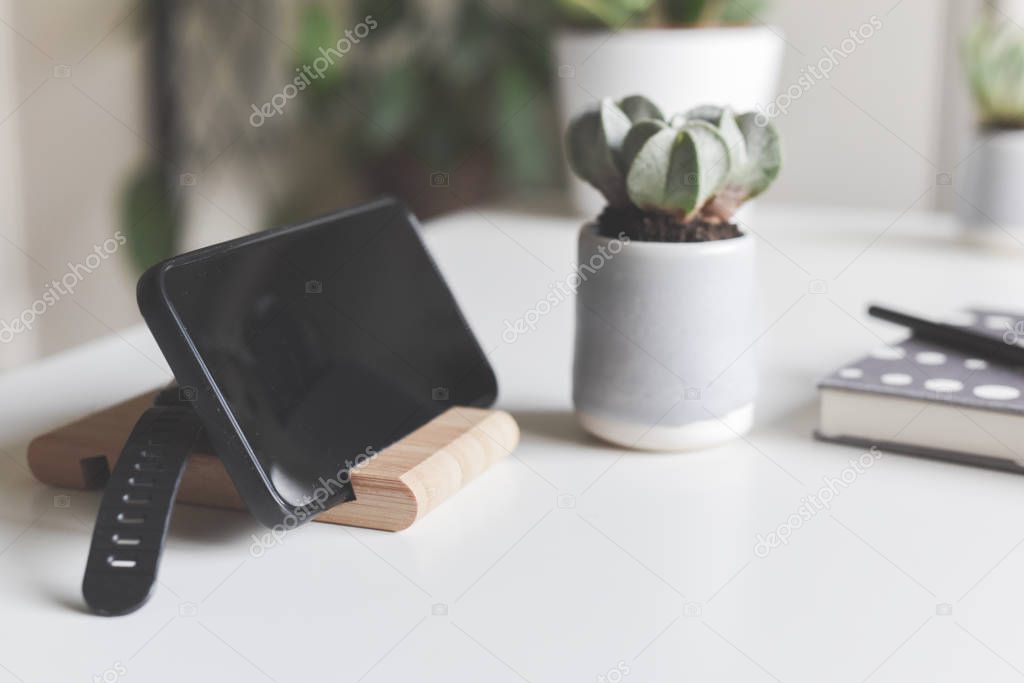 Office objects on a white desk in light modern style with copy s