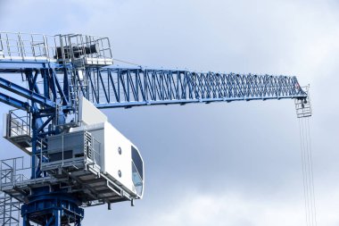 Large blue crane on a construction site on a commercial developm