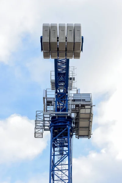 Large blue crane on a construction site on a commercial developm
