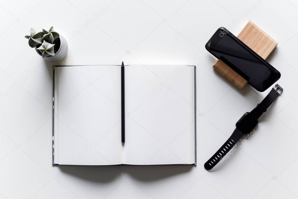 Trendy modern work area on a white desk in a light and bright ho