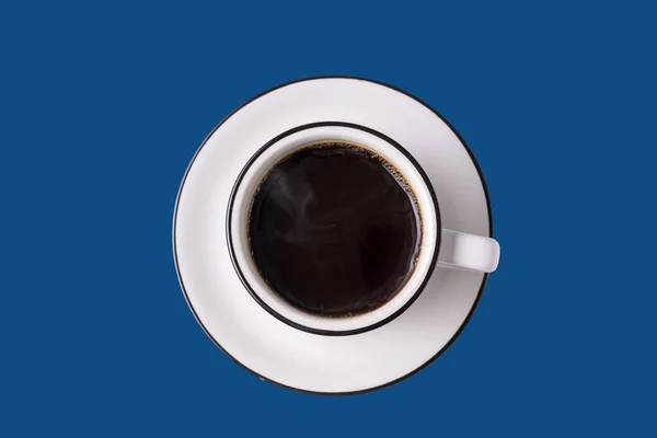 Coffee cup isolated on trendy classic blue background.