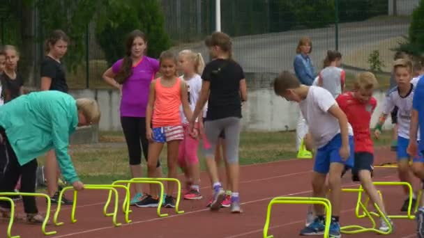 Pupils of the First Classes Trains on a Racetrack — Stockvideo