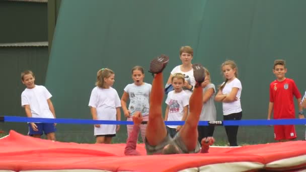 Adult Man Shows How Necessary to do a High Jump — Stock Video