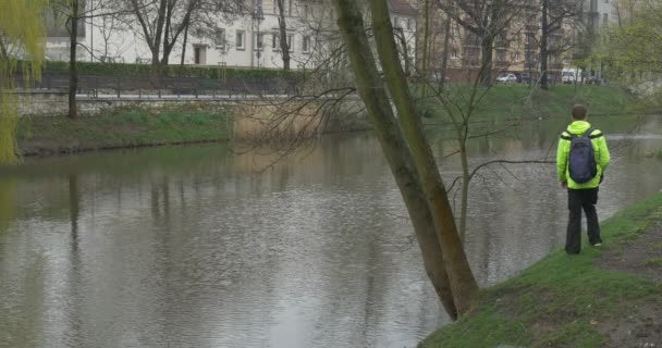 An Adult Man Approaches to a River — Stock Video