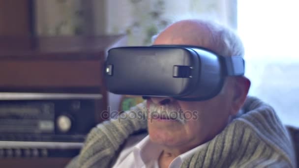 Old Man is Turning Head Watching vr Video Pointing to the Virtual Object and Wondering Modern Technology and Obsolete Interior Radiogram Link of Times — Stock Video