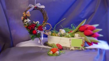 Opole, Poland - Feb 18 2017: Splendid Composition From Easter Hen and Quail Eggs, Rosy Tulips, a Nice Easter Decor Brown Ring With a Bow on It, a Photo Frame, a Set of Slide Cards