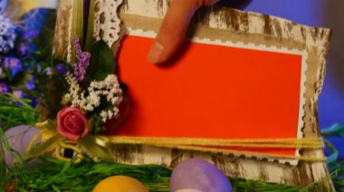 Opole, Poland - Jan 20 2017: Made of Easter Hen and Quail Eggs, a Festive Photo Frame, a Nice Bottle With a Candle, a Yellow Ring, a Set of Slide Cards, a Top Egg Cage