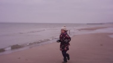 Girl Runs up to Her Mom With a Puzzled Look
