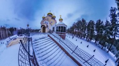 Tiny Little Planet. Coniferous Forest, Sky Over Orthodox Church. Spherical Video, Panorama Video, Time Lapse. Its Getting Dark on the Square, Light Comes From Church