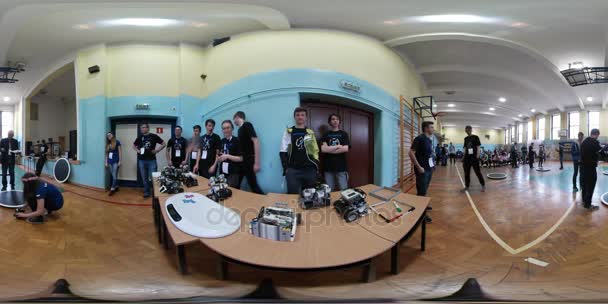 School Competition on Robotics Designing Opole 360Vr Video Teenagers Are Preparing Their Bots Waiting For Start Guy Puts His Robot Dow on the Table — Stock Video