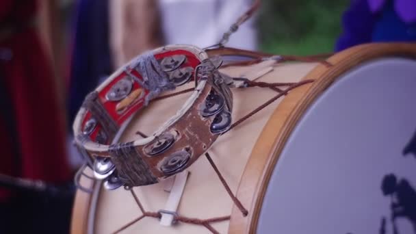 Woman Plays an Ethnic Music on Drum With Bells — Stock Video