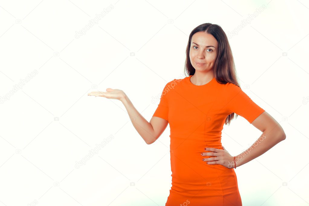 Girl in red dress on a white background indicates hand.
