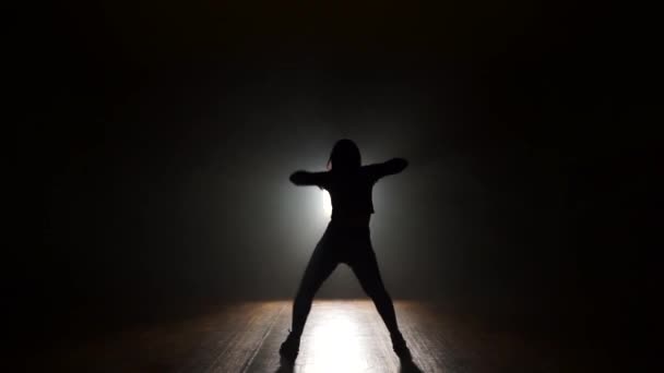 Dancer in studio with smooke on a dark background — Stock Video