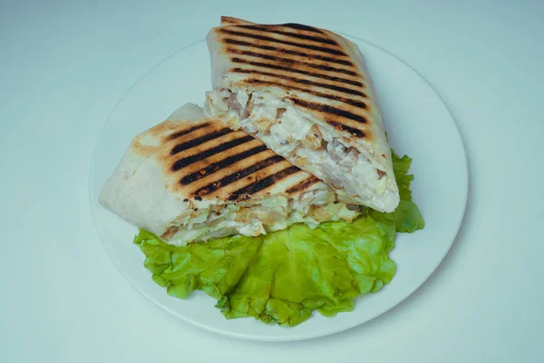 Shaurma grilled with chicken, French fries on a salad leaf. fast food — Stock Photo, Image