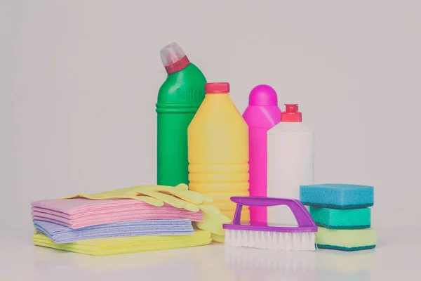 Range of household cleaners. Detergents, chemical bottles, cleaning sponges and gloves. on a white background
