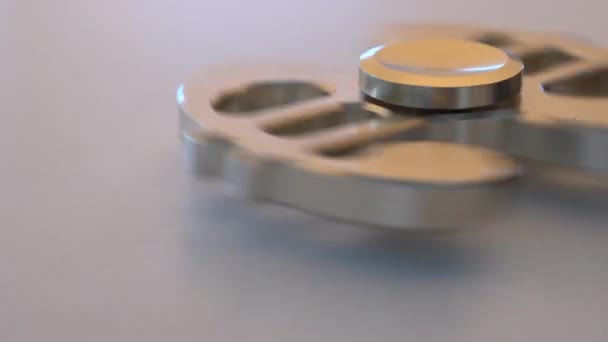 Spinner in the form of a dollar turns and stops spinning close-up — Stock Video