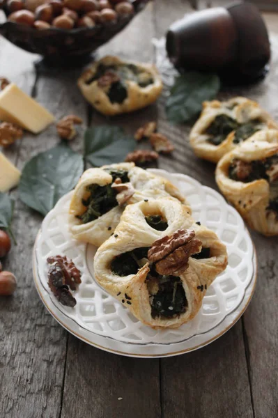 Spinach puffs with addition of cheese, walnuts and sesame seeds.Rustic style.