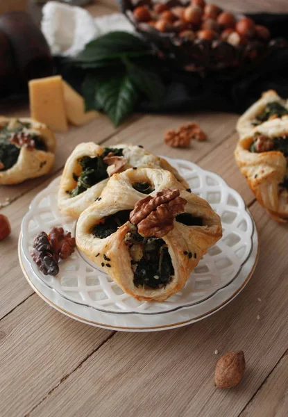 Spinach puffs with addition of cheese, walnuts and sesame seeds.Rustic style.