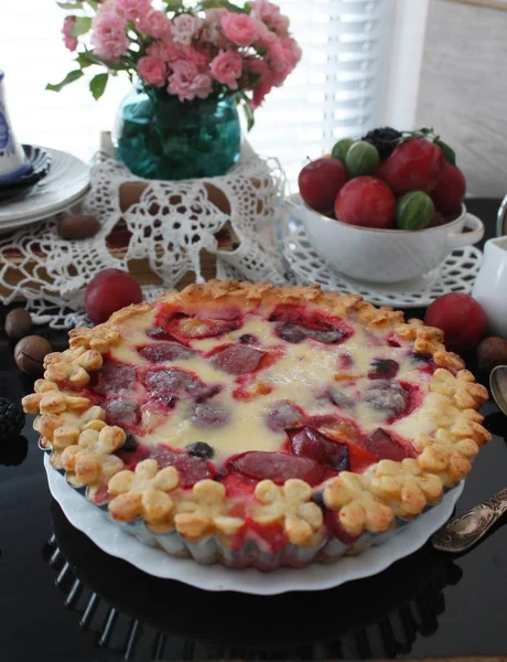 Fruit pie. Sweet pie, tart with fresh plums. Delicious cake with plums stock photo