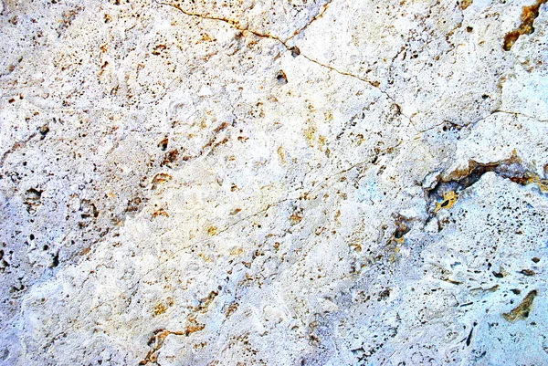 Oude beige stenen granieten muur — Stockfoto