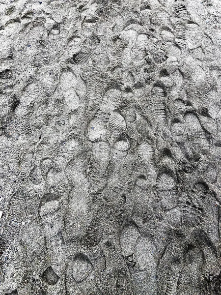 Marks from shoes on sandy beach — Stock Photo, Image