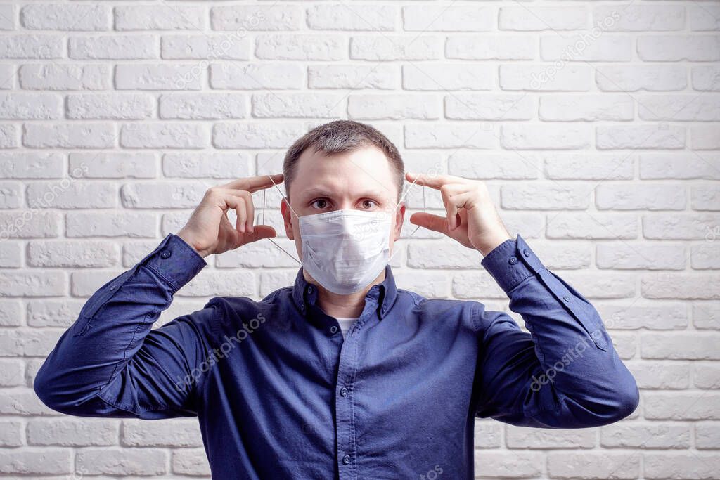 Protection against contagious disease, coronavirus. Man wearing hygienic mask to prevent infection, airborne respiratory illness such as flu, 2019-nCoV