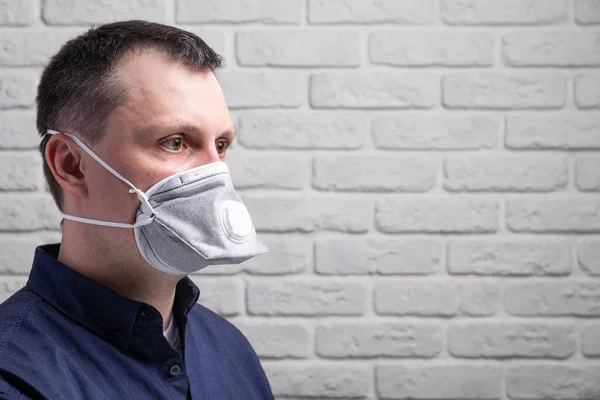 Protection against contagious disease, coronavirus. Man wearing hygienic mask to prevent infection, airborne respiratory illness such as flu, 2019-nCoV
