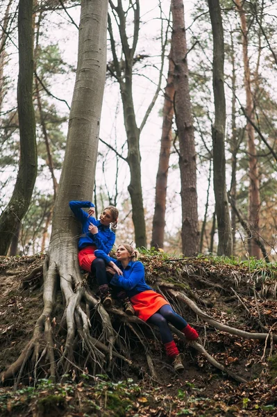 Twins in autumn forest — Stock Photo, Image