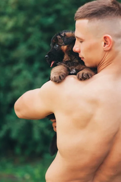 Athletic man and dog — Stock Photo, Image