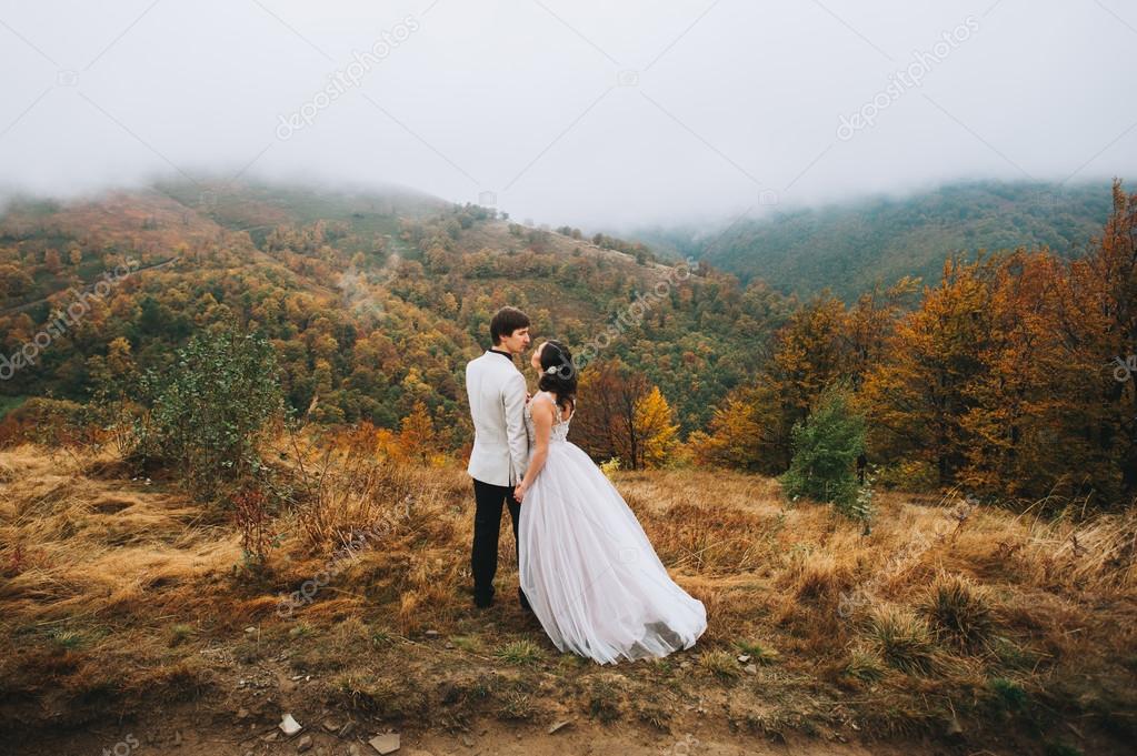 happy couple in mountains