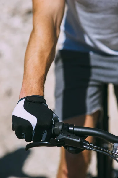 Male hand on bicycle — Stock Photo, Image