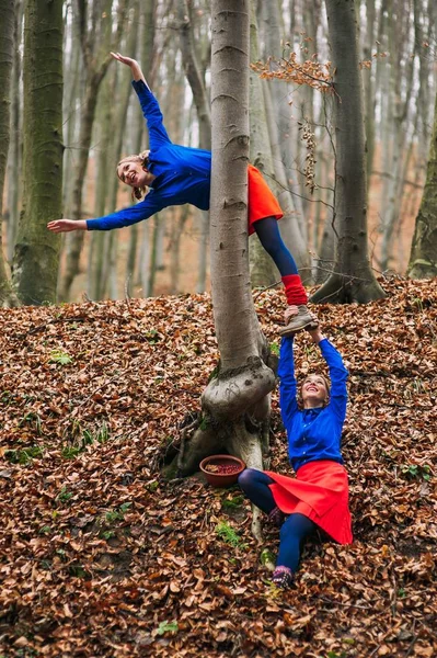 Twins in autumn forest — Stock Photo, Image