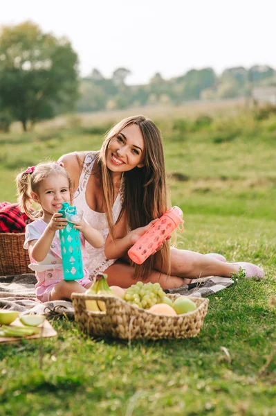 Mother and daughter have picnic — Stock Photo, Image