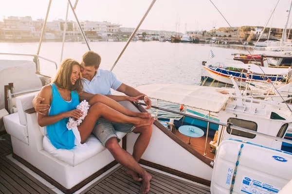 Couple sitting on yacht deck — Stock Photo, Image