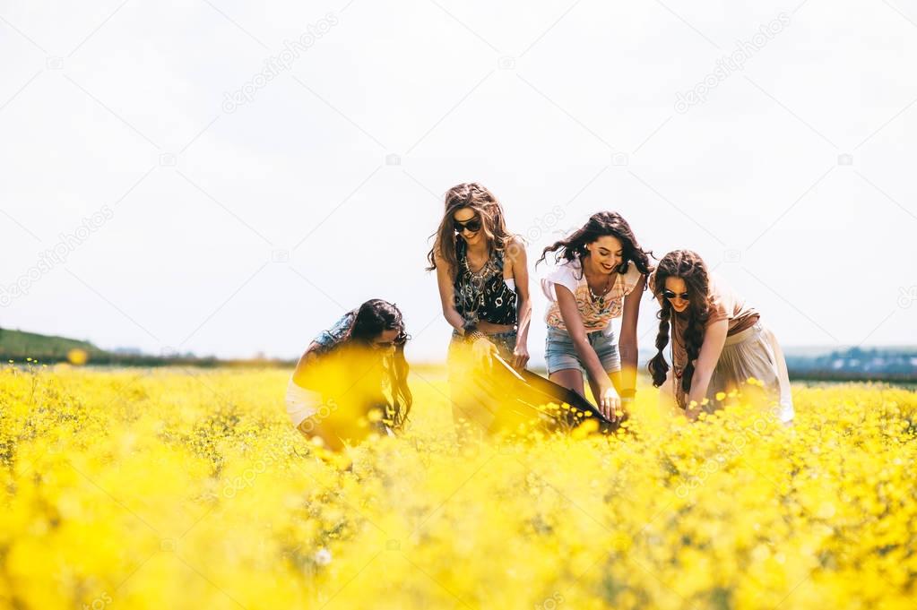 hippie girls in field 