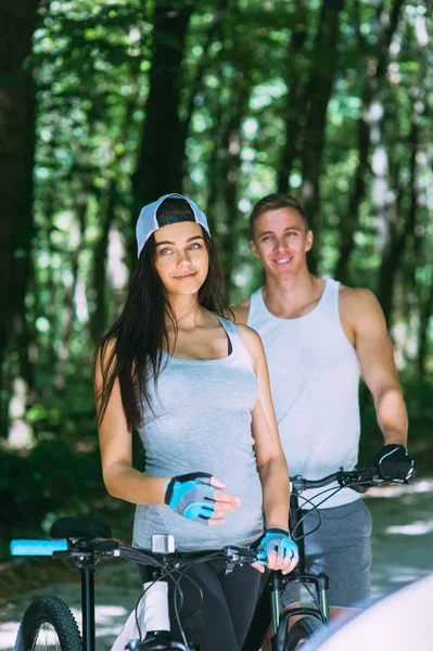 Young Couple Riding Bikes