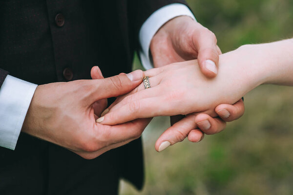married couple holding hands 