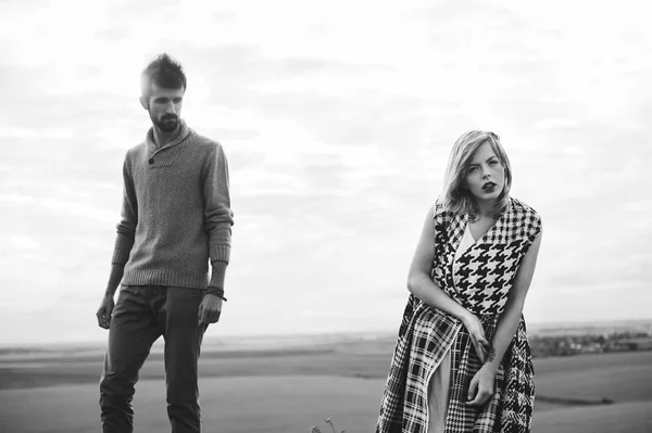 Loving couple wrapped in plaid — Stock Photo, Image