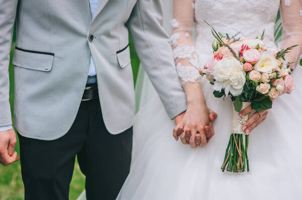 Loving couple holding hands 