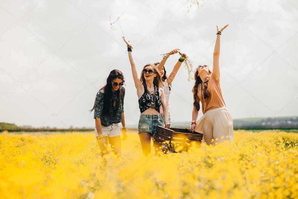 four beautiful  girls in a field 