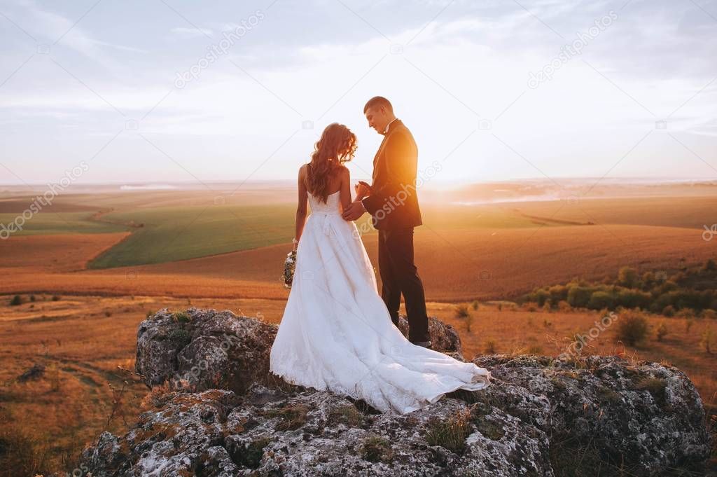 beautiful wedding couple posing  in the mountains