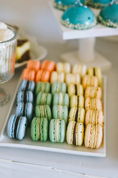 Macaroons tasty french dessert on white plate