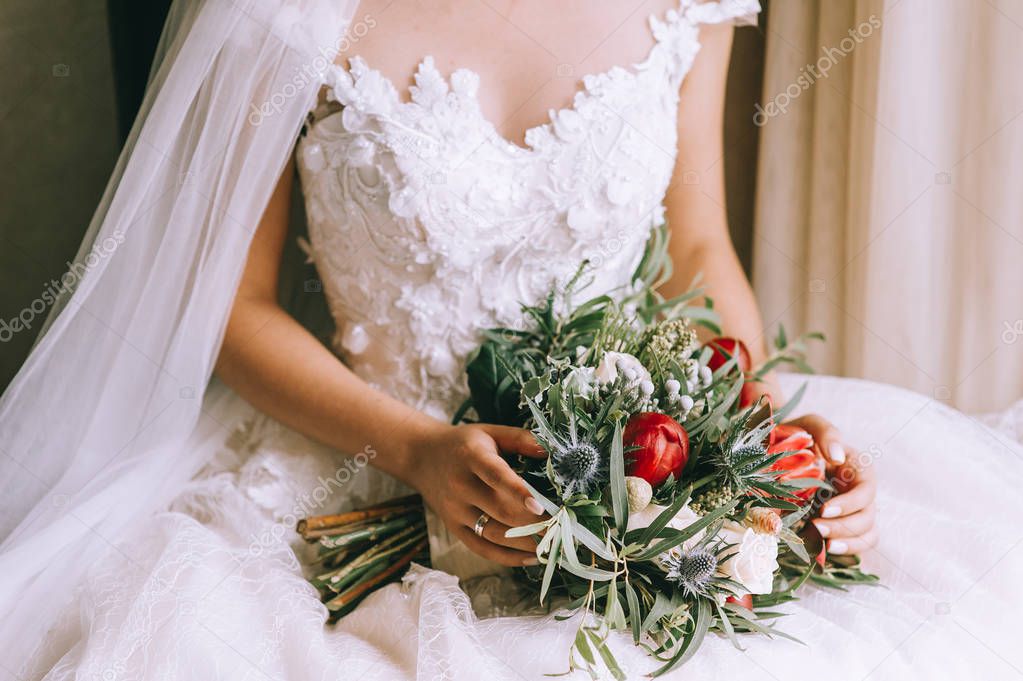 Beautiful wedding bouquet in hands of the bride, close-up view 
