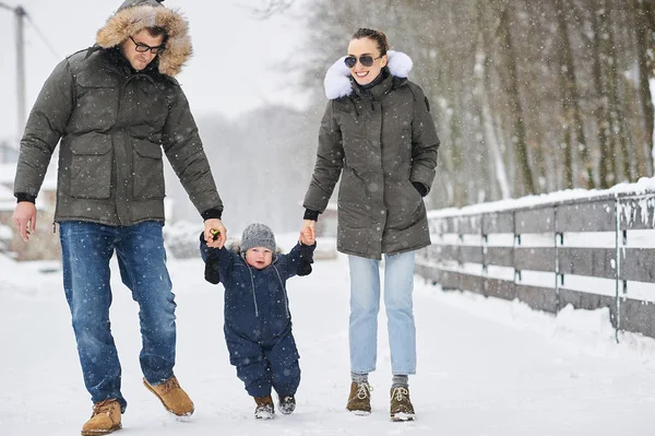 Happy family have a fun outside near the house in winter — Stock Photo, Image