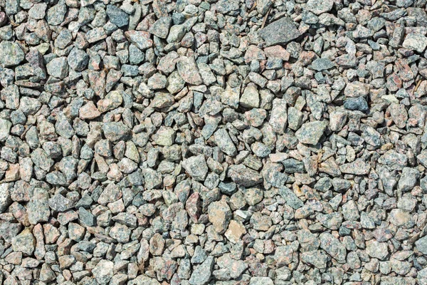 Crushed grey stone on the ground texture — Stock Photo, Image