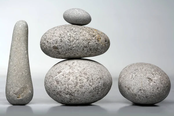 Stack of stones - pebbles on grey background — Stock Photo, Image